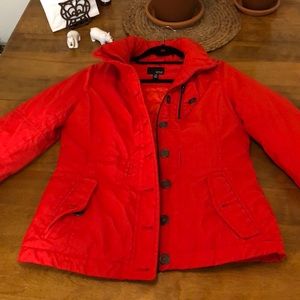 Ana brand bright orange puffer jacket.